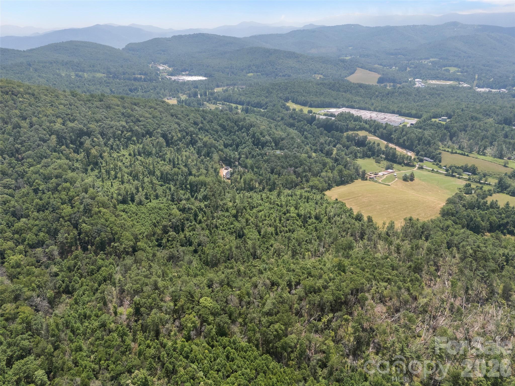 1305 Halltown Road Spruce Pine, NC 28777 - Photo 8 of 45 a view of a lake in middle of the town