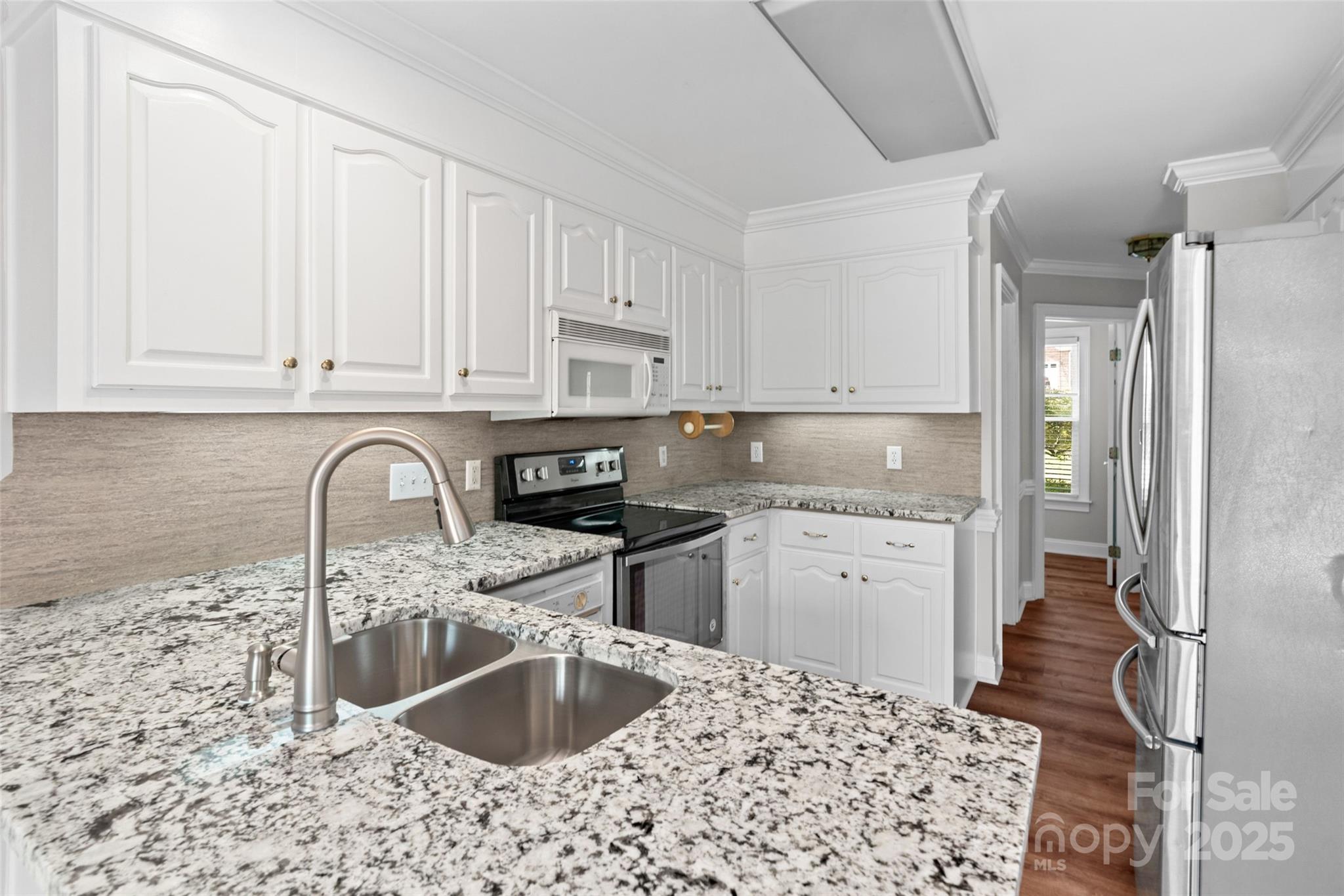 2082 Egret Court Rock Hill, SC 29732 - Photo 12 of 36 a kitchen with granite countertop a sink stainless steel appliances and cabinets