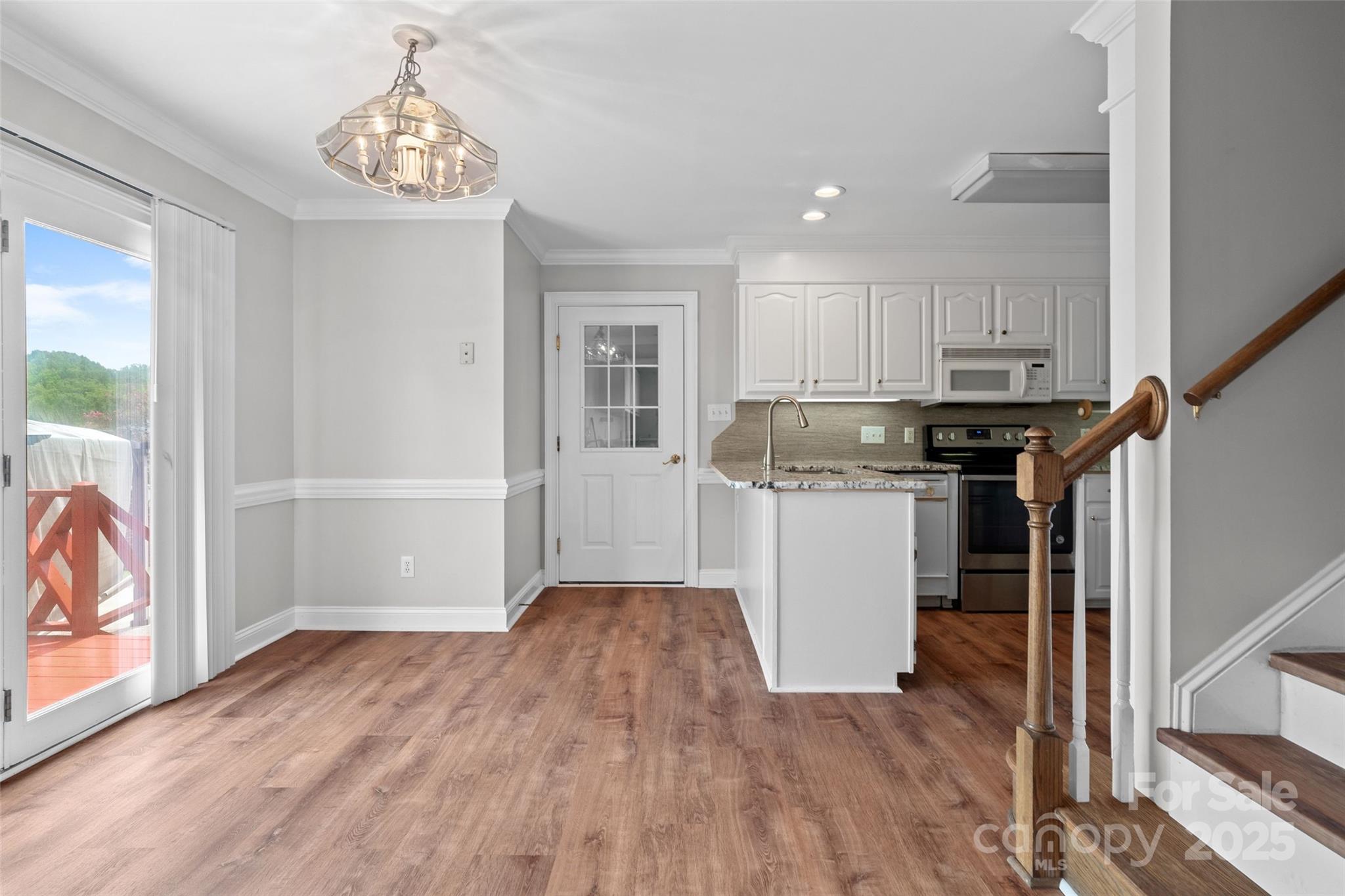 2082 Egret Court Rock Hill, SC 29732 - Photo 8 of 36 a kitchen with stainless steel appliances granite countertop a refrigerator a stove and a wooden floors