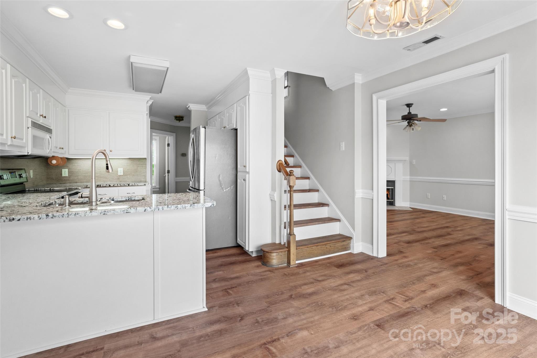 2082 Egret Court Rock Hill, SC 29732 - Photo 9 of 36 a view of kitchen with stainless steel appliances wooden floor and cabinets