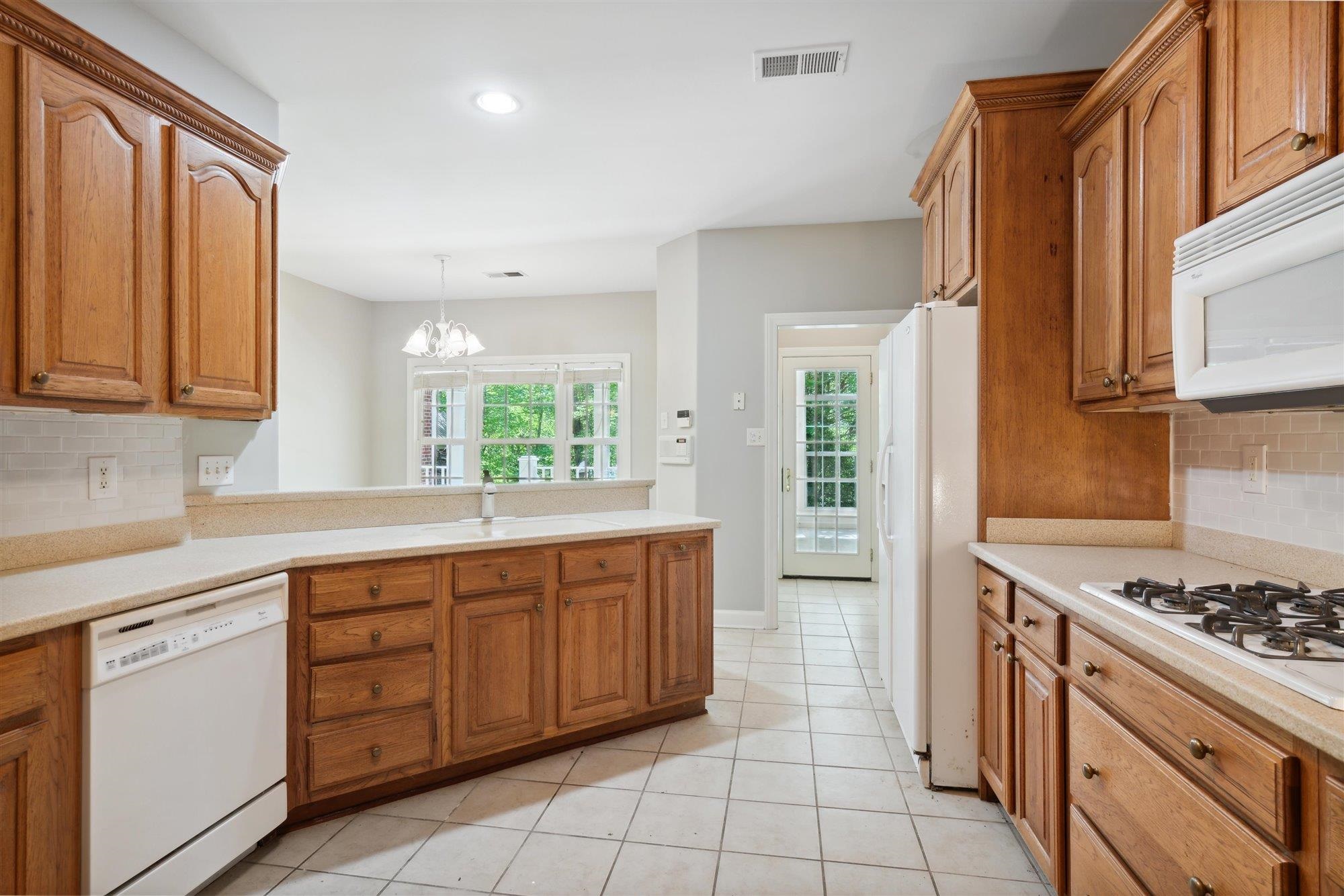 139 Pine Ridge Cove Holly Springs, MS 38635 - Photo 15 of 38 a kitchen with stainless steel appliances granite countertop a stove and a sink