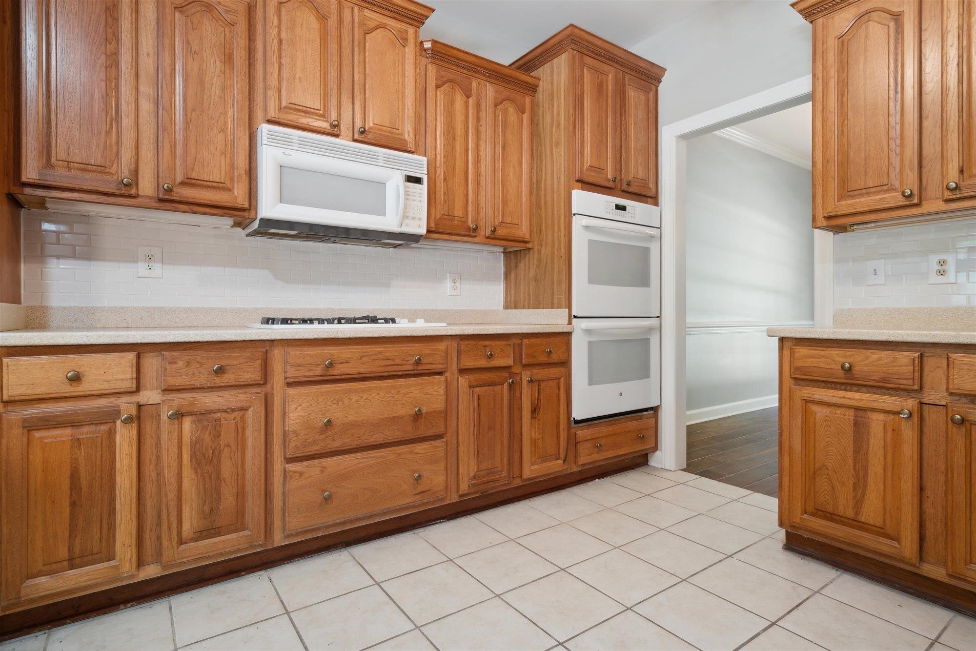139 Pine Ridge Cove Holly Springs, MS 38635 - Photo 16 of 38 a kitchen with stainless steel appliances granite countertop a refrigerator and cabinets