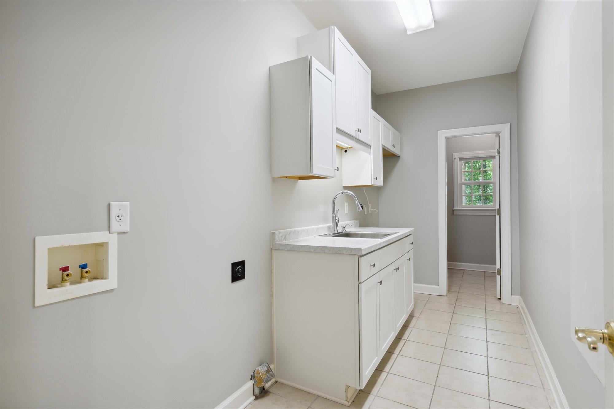 139 Pine Ridge Cove Holly Springs, MS 38635 - Photo 17 of 38 a spacious bathroom with a double vanity sink and mirror