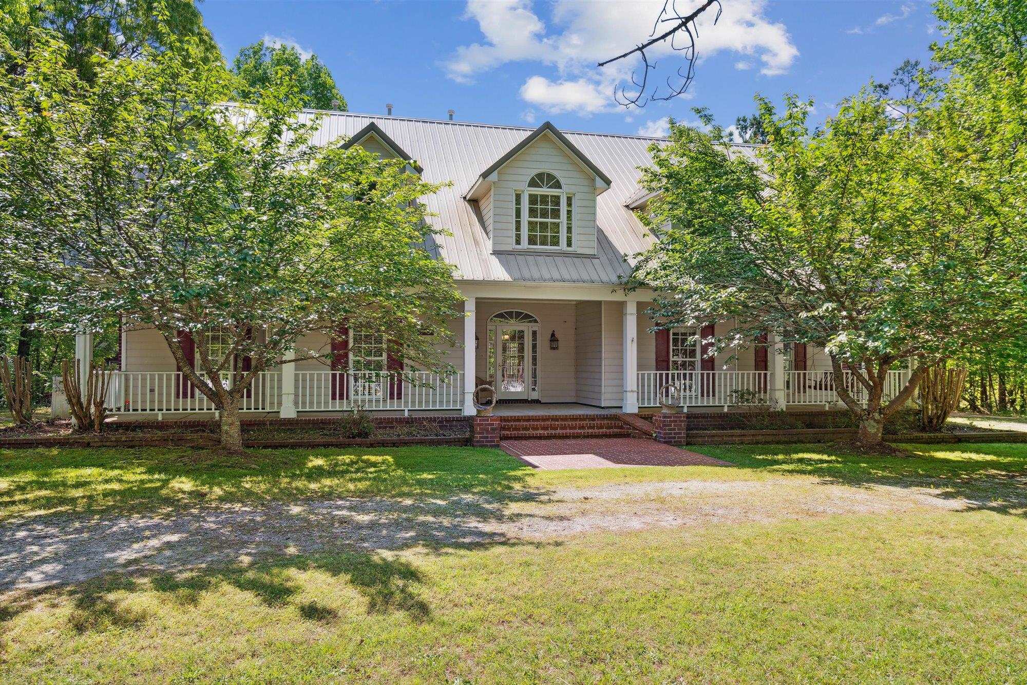 139 Pine Ridge Cove Holly Springs, MS 38635 - Photo 3 of 38 a front view of a house with a yard