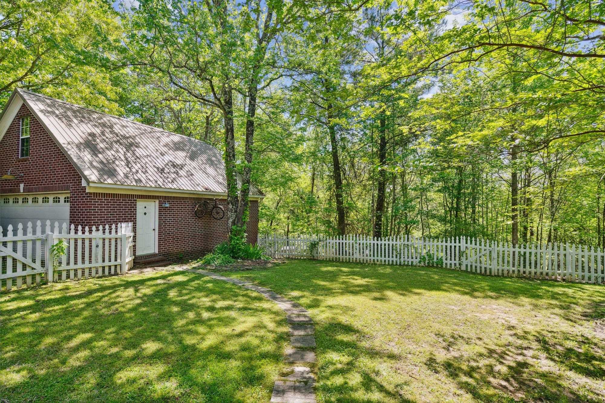 139 Pine Ridge Cove Holly Springs, MS 38635 - Photo 38 of 38 a view of a backyard with a tree