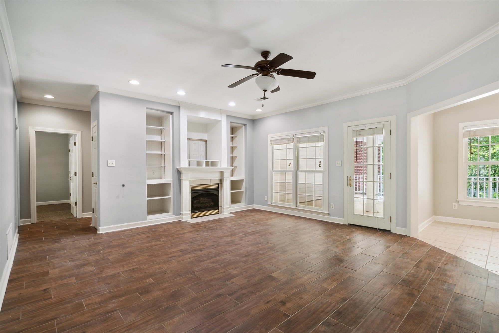 139 Pine Ridge Cove Holly Springs, MS 38635 - Photo 10 of 38 a view of an empty room with a window and kitchen view