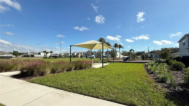 a view of a bench in patio with a yard