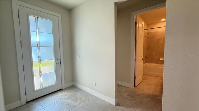 a view of a kitchen and a window