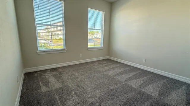 a bathroom with a double vanity sink a mirror and a shower