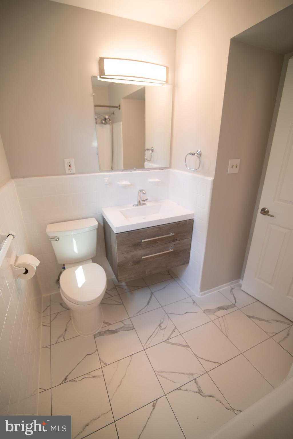 5414 Gainesville Road Springfield, VA 22151 - Photo 22 of 35 Upper full bath with Carrera marble flooring