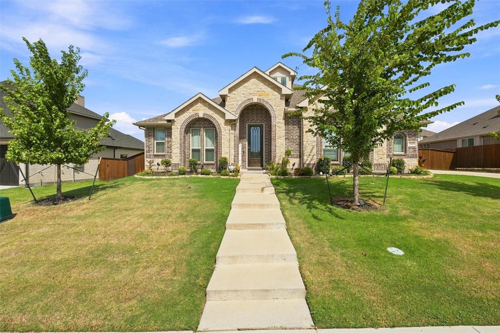 5225 Rowlan Row Midlothian, TX 76065 - Photo 1 of 33 Brick and stone façade with arched entryway