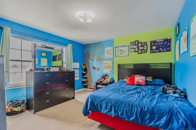 a bed room with a bed and a fireplace