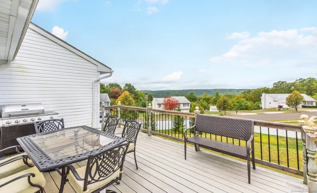 a view of a balcony with furniture