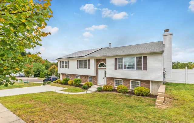 a front view of a house with a yard