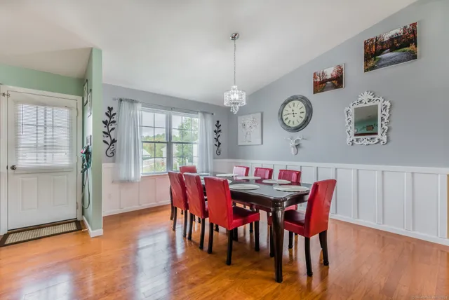 a view of a dining room with furniture window and wooden floor
