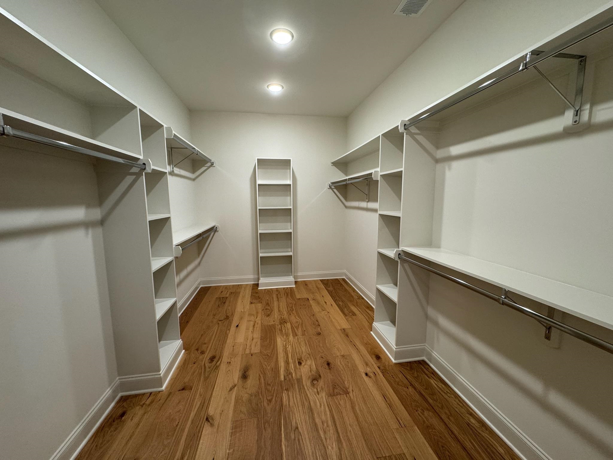 11512 Sunsparkler Way Collierville, TN 38017 - Photo 25 of 40 Walk in closet with dark wood-style floors