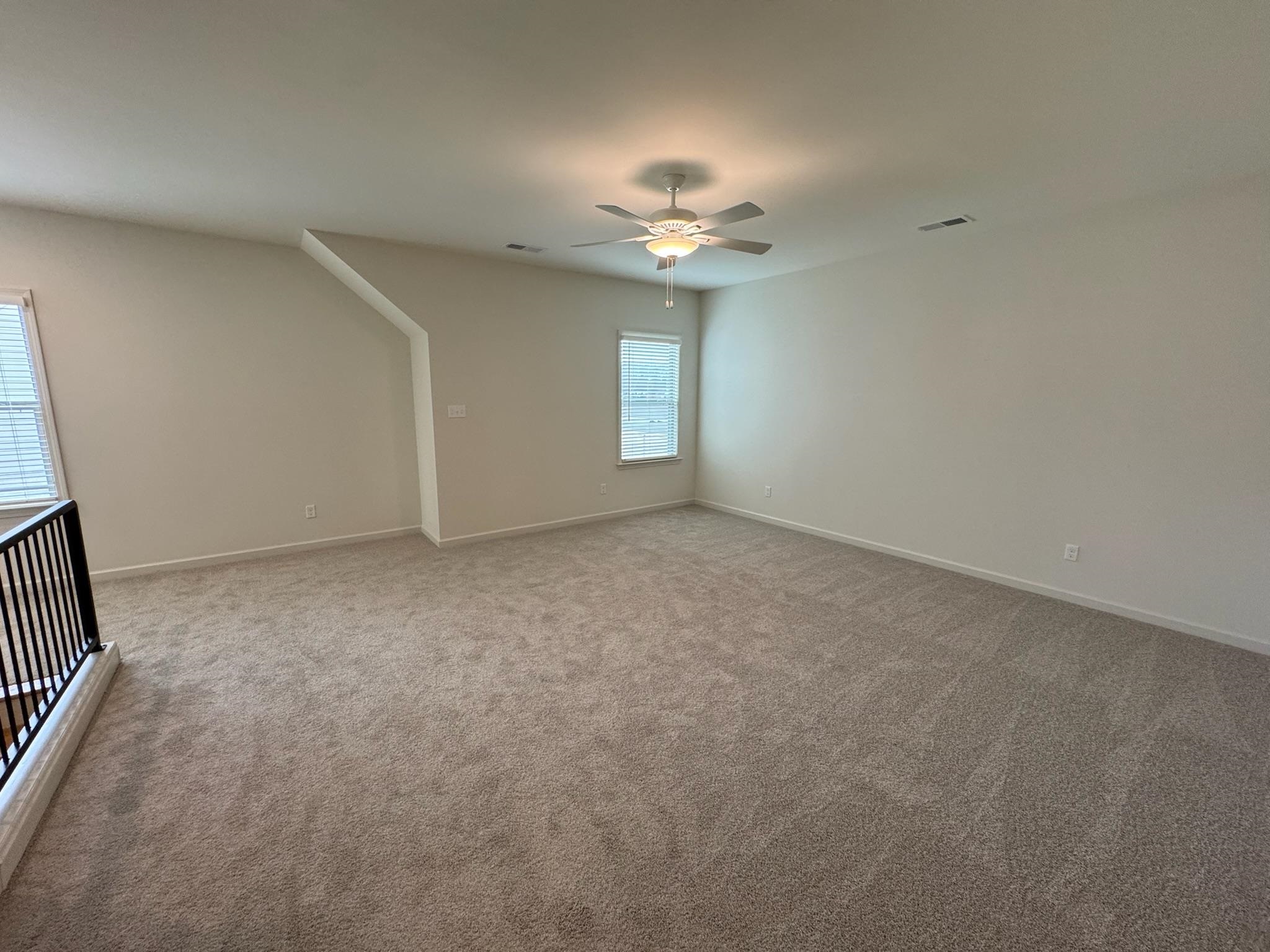 11512 Sunsparkler Way Collierville, TN 38017 - Photo 27 of 40 Empty room with ceiling fan and carpet flooring