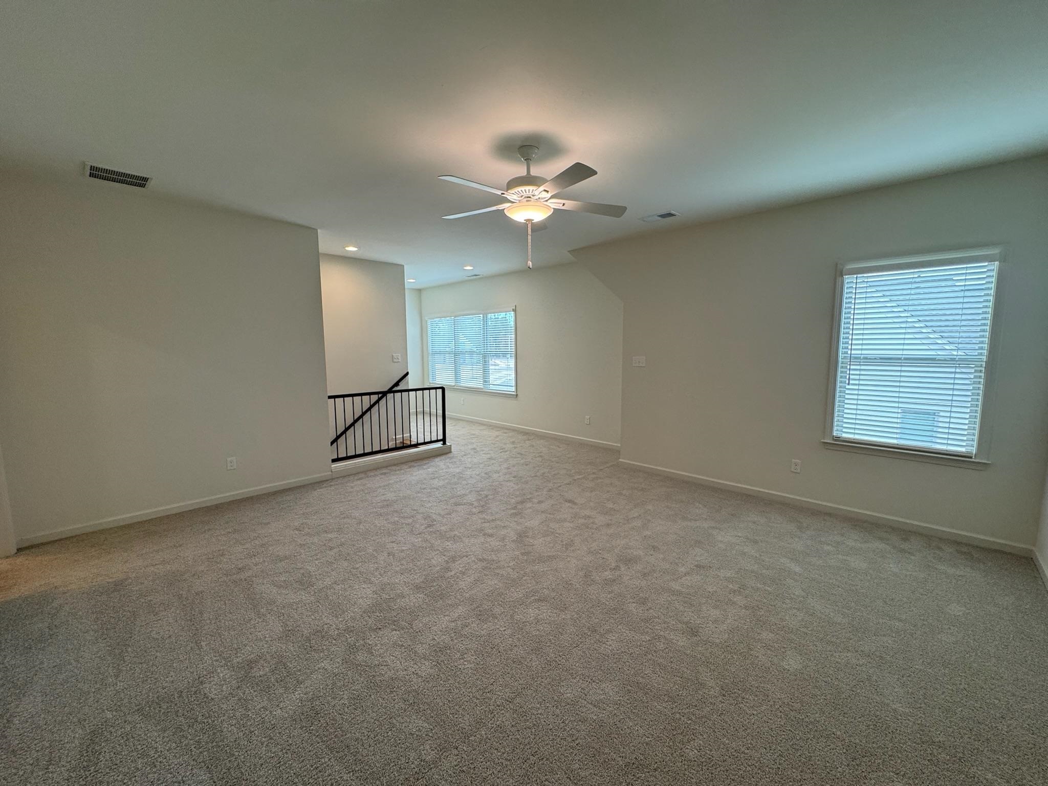 11512 Sunsparkler Way Collierville, TN 38017 - Photo 28 of 40 Unfurnished room featuring ceiling fan, light colored carpet, and recessed lighting
