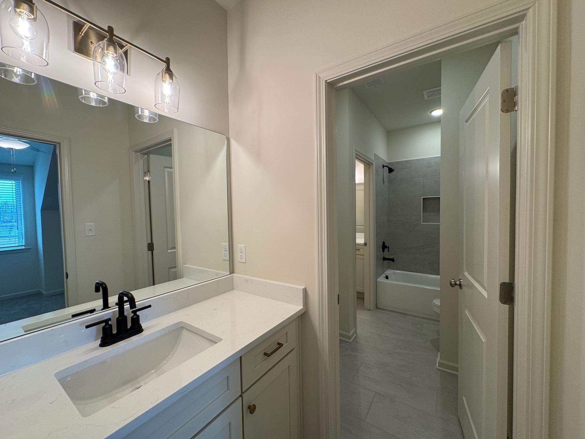 11512 Sunsparkler Way Collierville, TN 38017 - Photo 32 of 40 Bathroom with vanity and tub / shower combination
