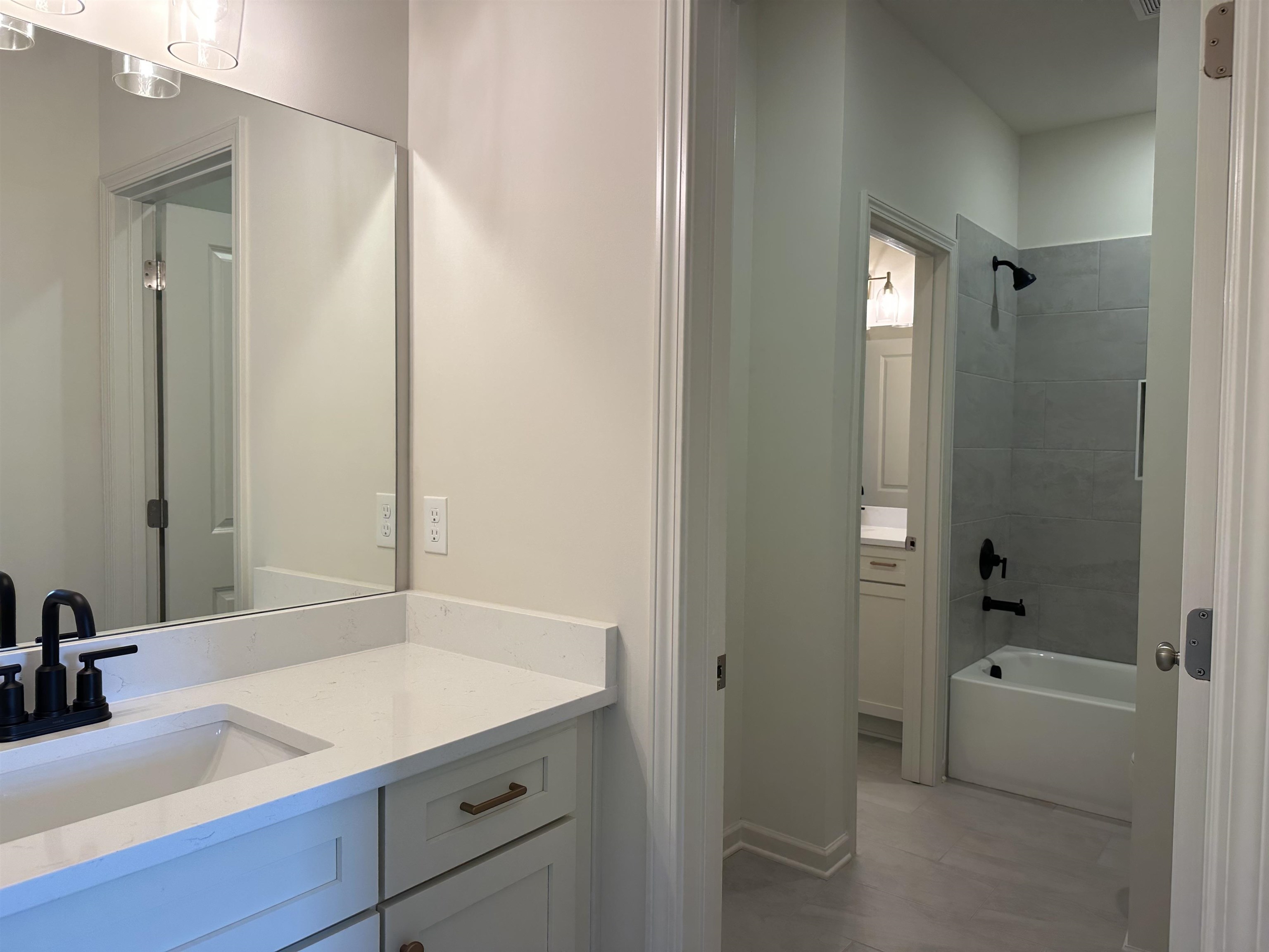 11512 Sunsparkler Way Collierville, TN 38017 - Photo 9 of 9 a bathroom with a tub sink and mirror