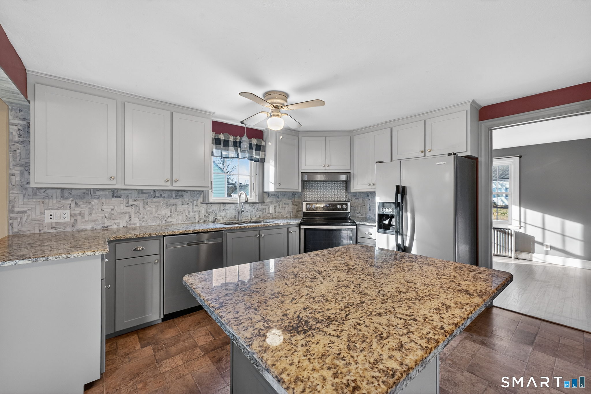 32 Garvan Street Newington, CT 06111 - Photo 11 of 36 a kitchen with stainless steel appliances granite countertop a sink refrigerator and microwave