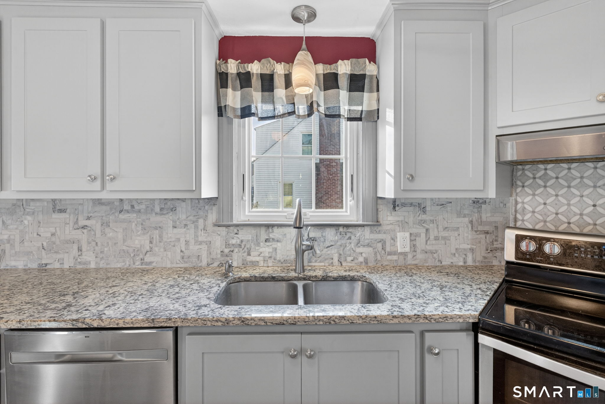 32 Garvan Street Newington, CT 06111 - Photo 12 of 36 a kitchen with granite countertop a sink and cabinets