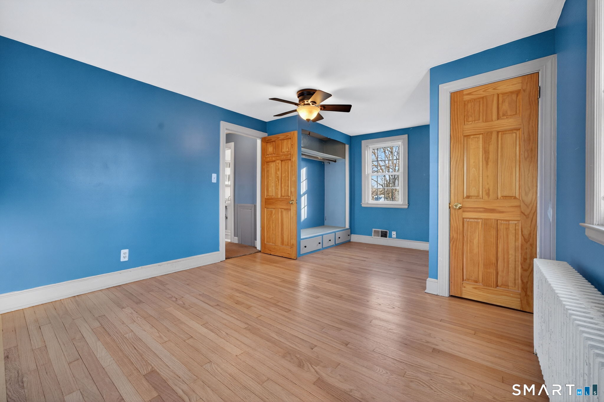 32 Garvan Street Newington, CT 06111 - Photo 22 of 36 a view of an empty room with window and wooden floor