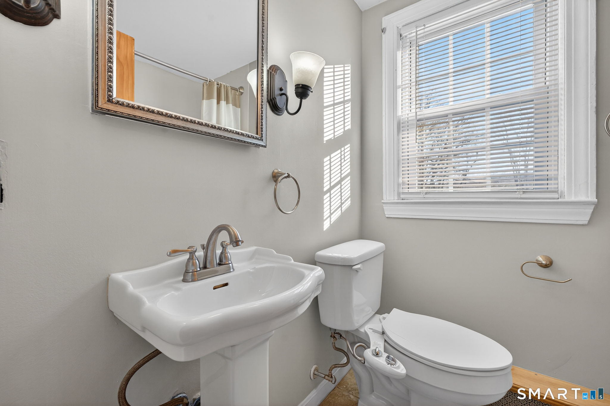 32 Garvan Street Newington, CT 06111 - Photo 23 of 36 a bathroom with a toilet a sink and mirror
