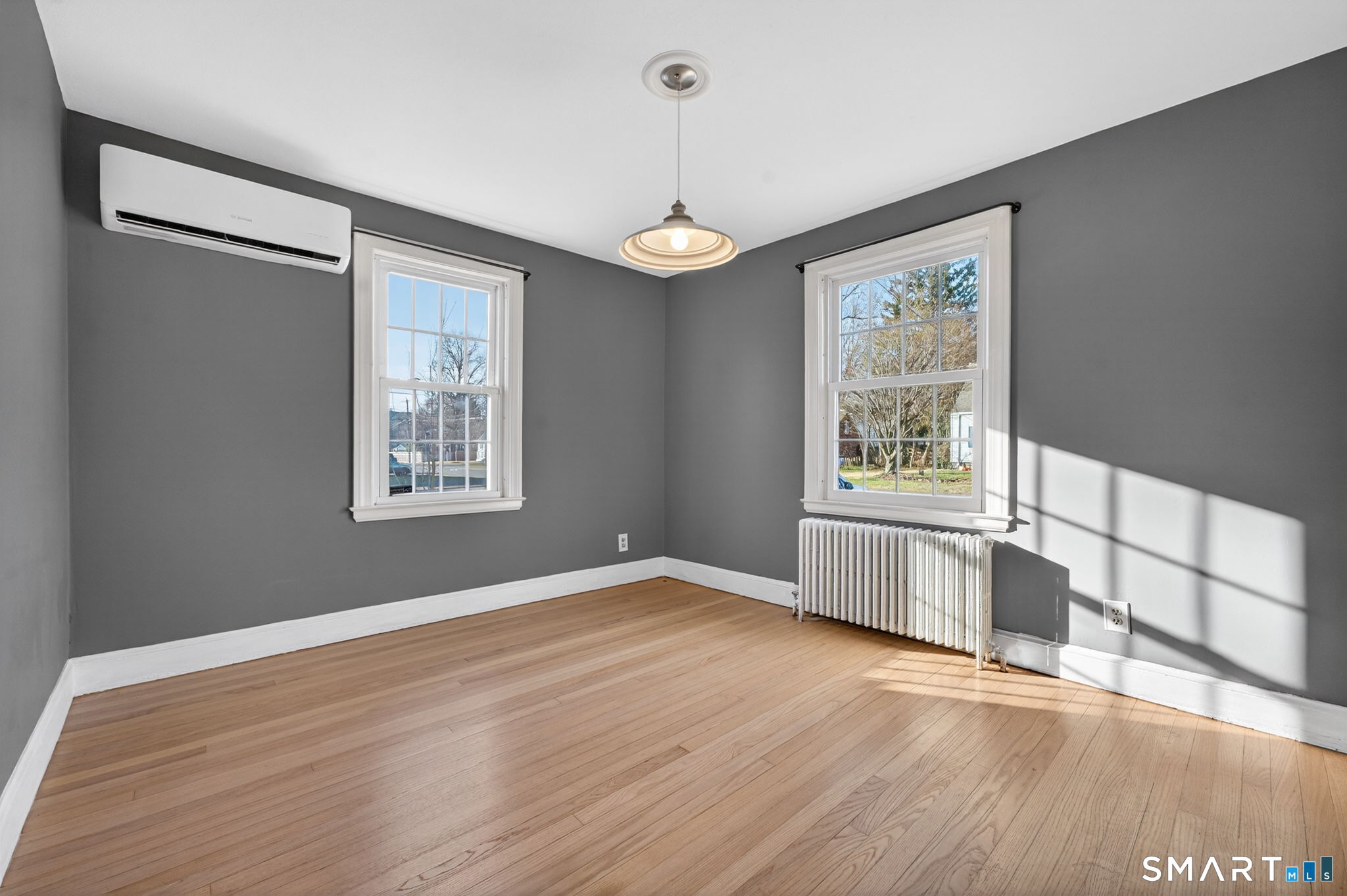 32 Garvan Street Newington, CT 06111 - Photo 7 of 36 a view of an empty room with wooden floor and a window