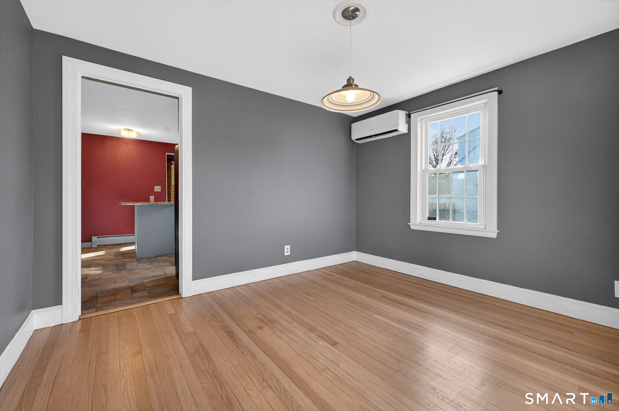 32 Garvan Street Newington, CT 06111 - Photo 8 of 36 an empty room with wooden floor and windows
