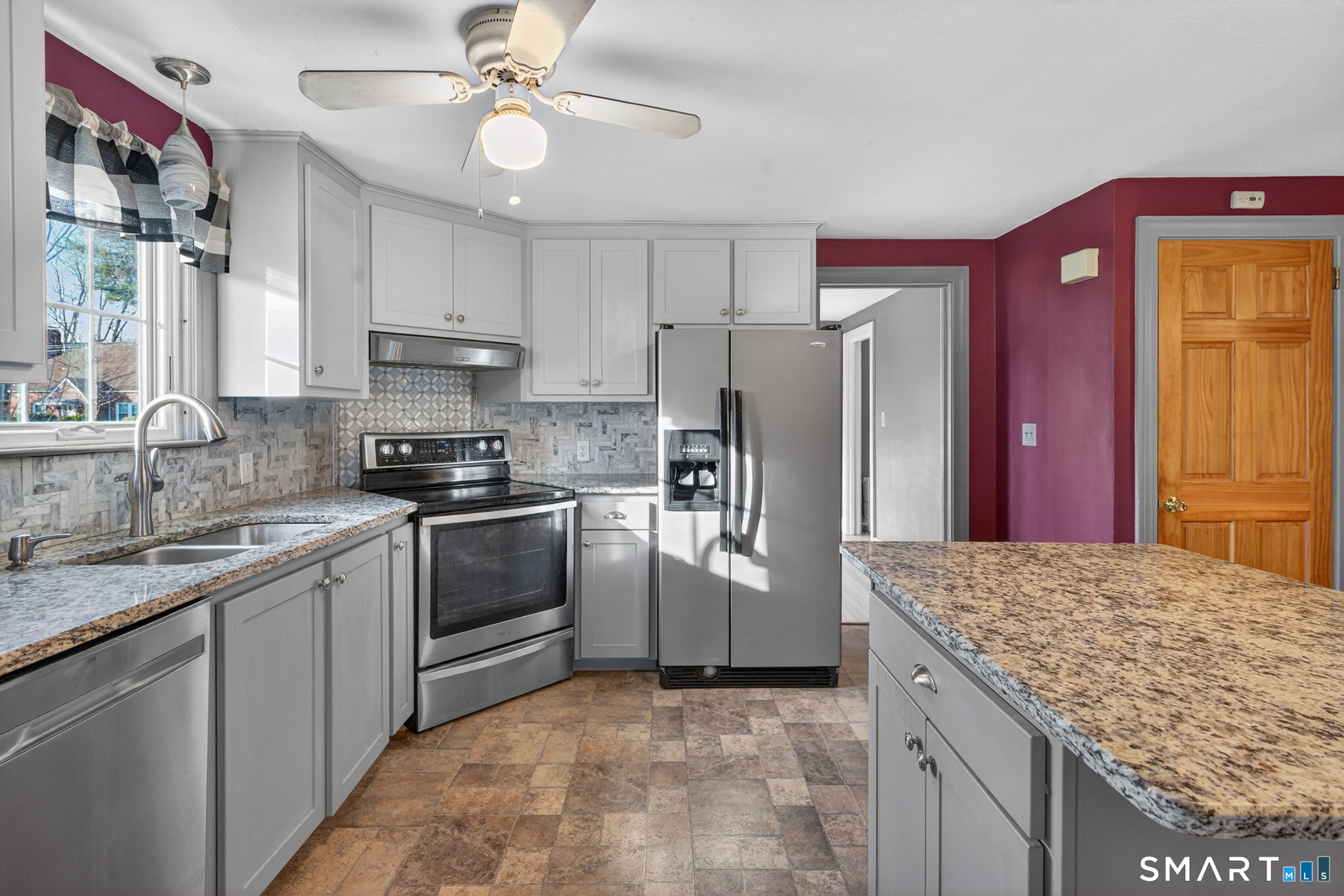 32 Garvan Street Newington, CT 06111 - Photo 9 of 36 a kitchen with stainless steel appliances granite countertop a sink stove and refrigerator