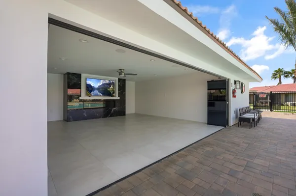 a view of living room with furniture and a fireplace