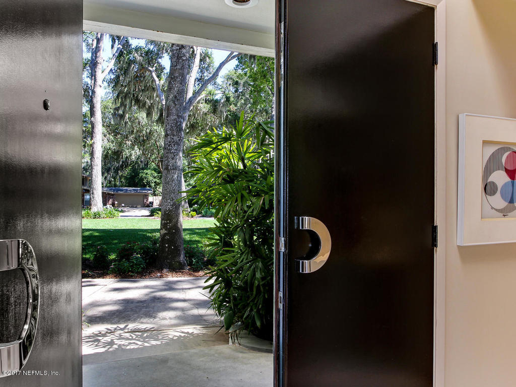 3039 Front Road Jacksonville, FL 32257 - Photo 13 of 71 a view of a door of the house and garden