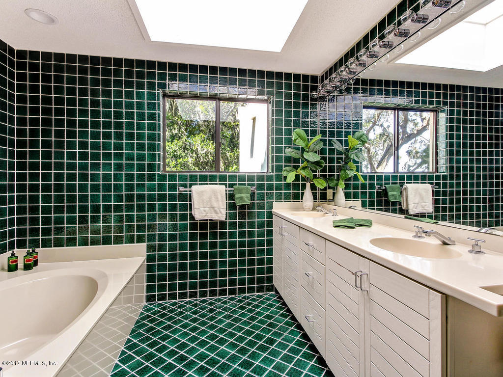 3039 Front Road Jacksonville, FL 32257 - Photo 47 of 71 a bathroom with a sink mirror toilet and bathtub