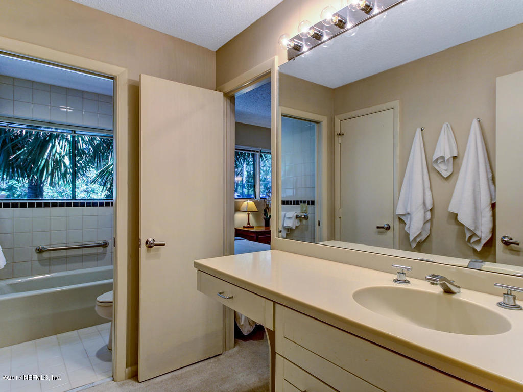 3039 Front Road Jacksonville, FL 32257 - Photo 49 of 71 a bathroom with a sink and a mirror