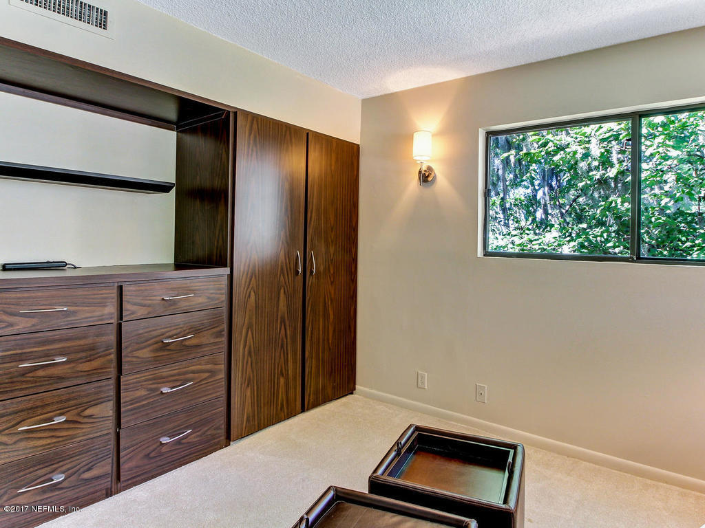 3039 Front Road Jacksonville, FL 32257 - Photo 51 of 71 a room with a dresser and a window