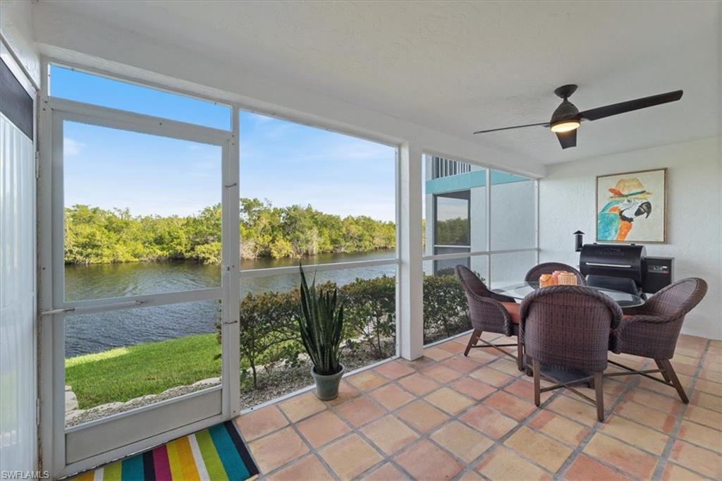 1375 Mainsail Drive, Unit 1702 Naples, FL 34114 - Photo 11 of 38 a workspace with furniture and a window