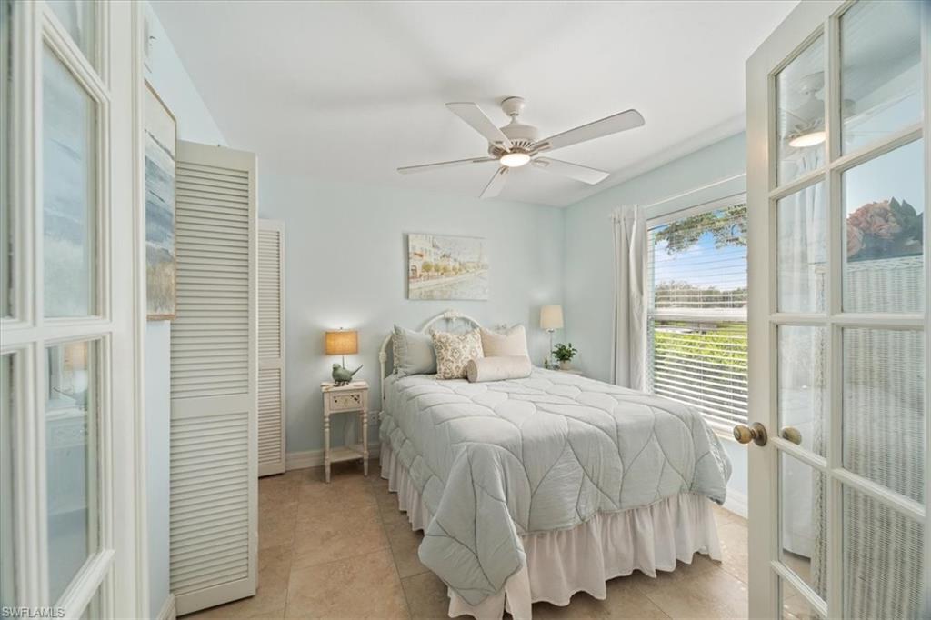 1375 Mainsail Drive, Unit 1702 Naples, FL 34114 - Photo 24 of 38 a bedroom with a bed and a window