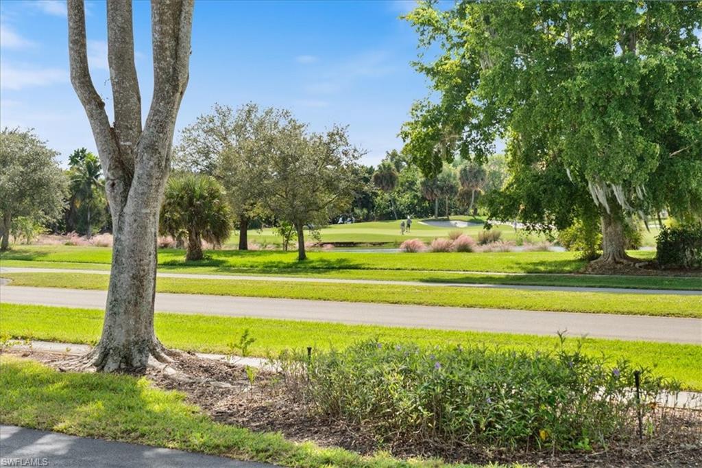 1375 Mainsail Drive, Unit 1702 Naples, FL 34114 - Photo 29 of 38 a view of a yard with swimming pool