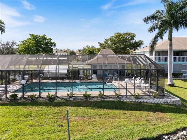 a view of a swimming pool with a garden