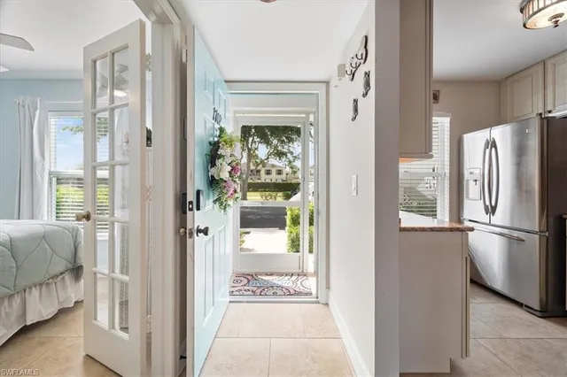 a view of a kitchen with a refrigerator