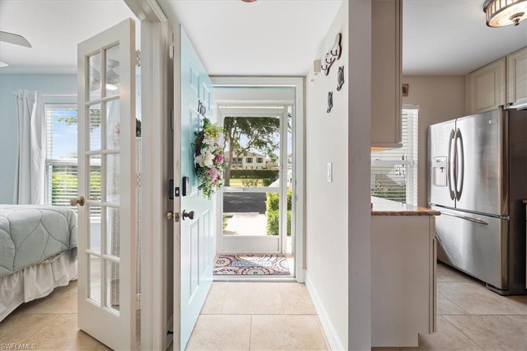 1375 Mainsail Drive, Unit 1702 Naples, FL 34114 - Photo 37 of 38 a view of a kitchen with a refrigerator