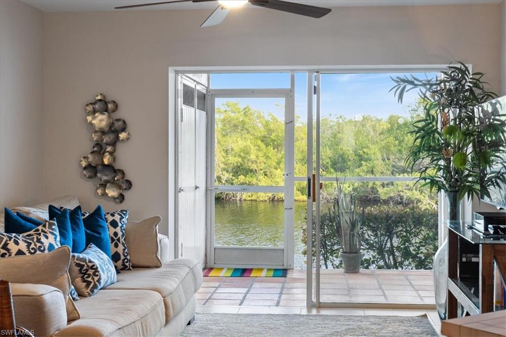 1375 Mainsail Drive, Unit 1702 Naples, FL 34114 - Photo 6 of 38 a living room with furniture and a large window