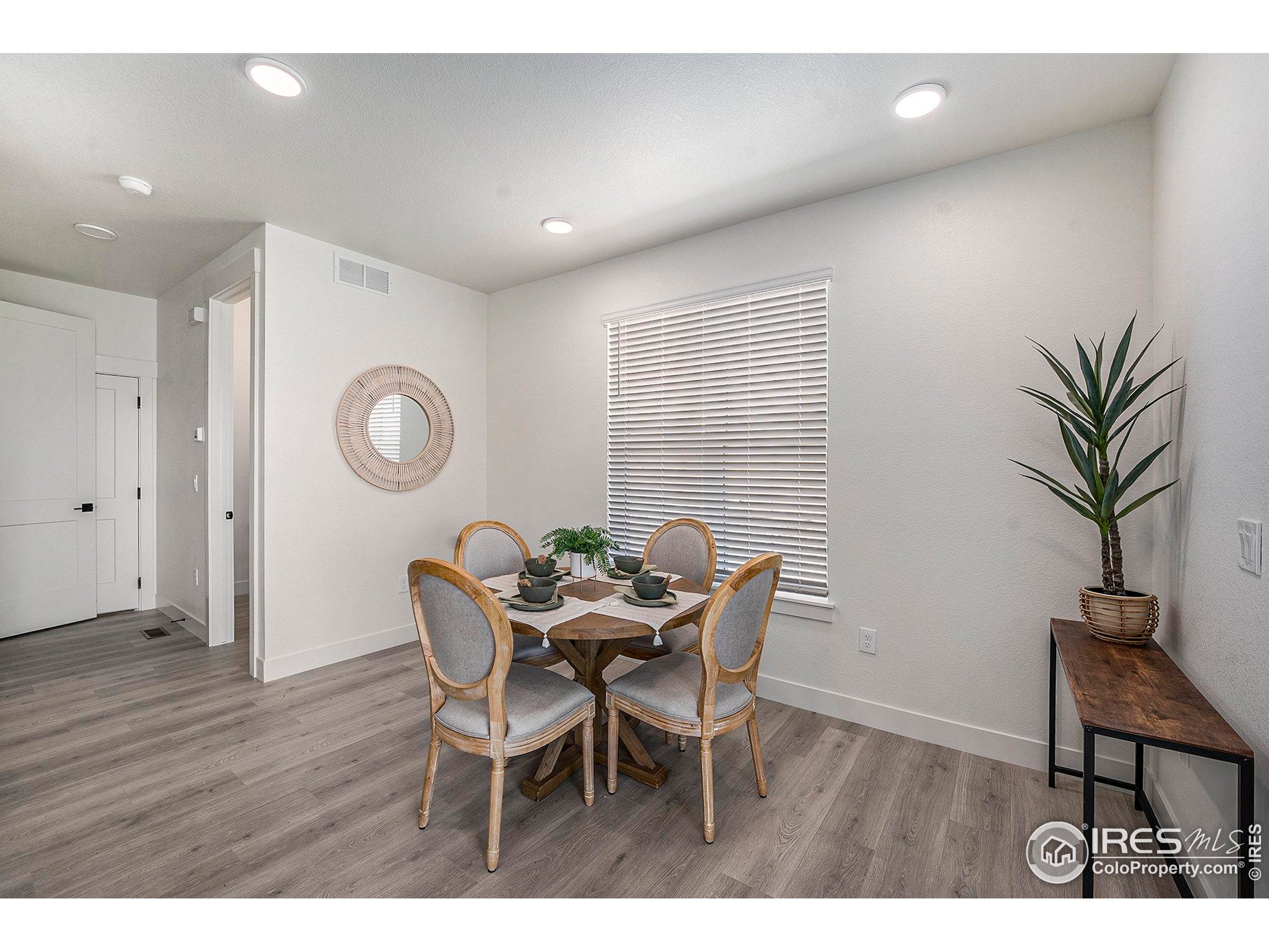 5001 Avon Avenue Loveland, CO 80538 - Photo 6 of 16 a view of a dining room with furniture and wooden floor