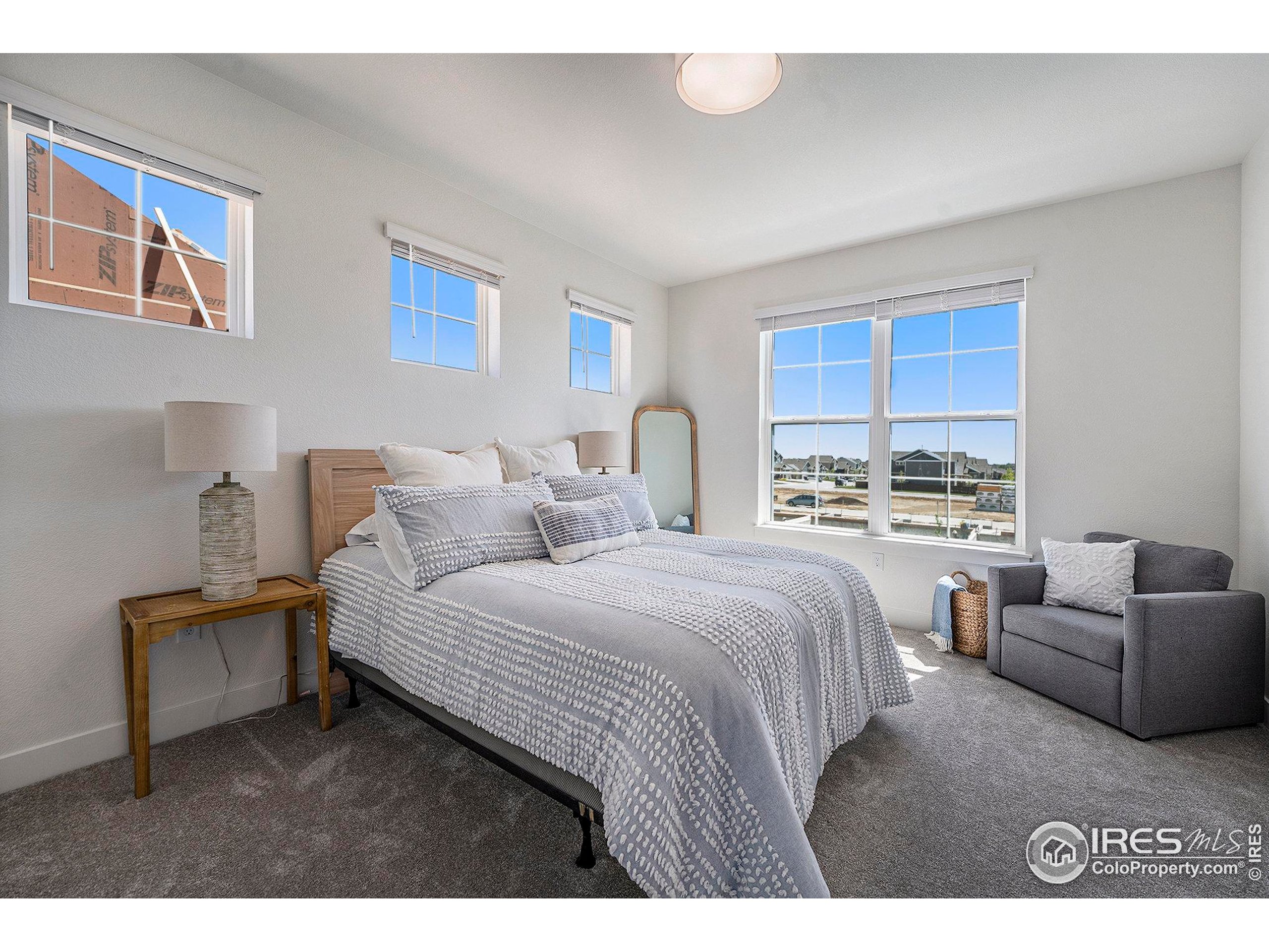 5001 Avon Avenue Loveland, CO 80538 - Photo 8 of 16 a bedroom with bed and window