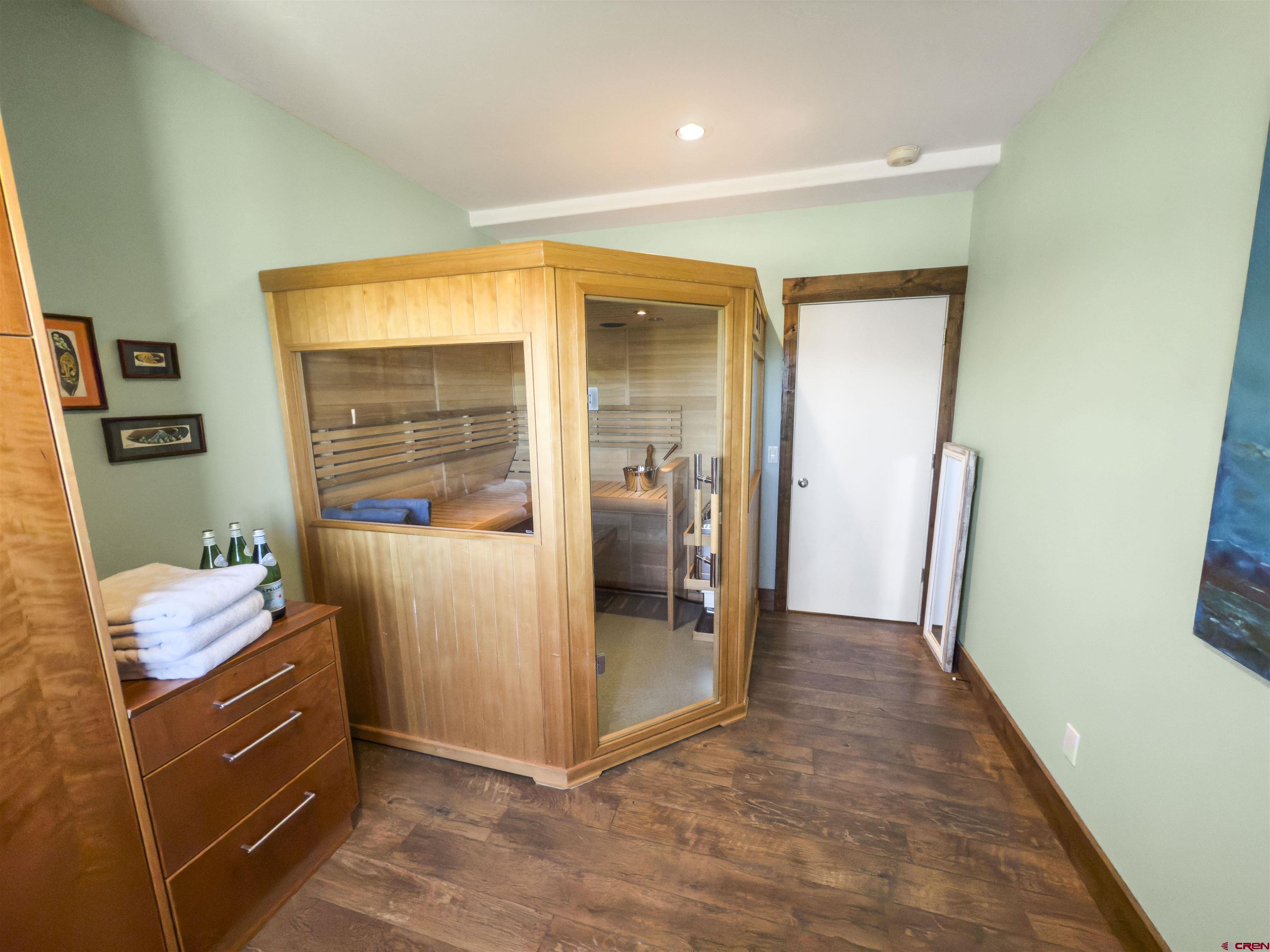 684 Falcon Way Montrose, CO 81403 - Photo 24 of 43 a room with furniture and wooden floor