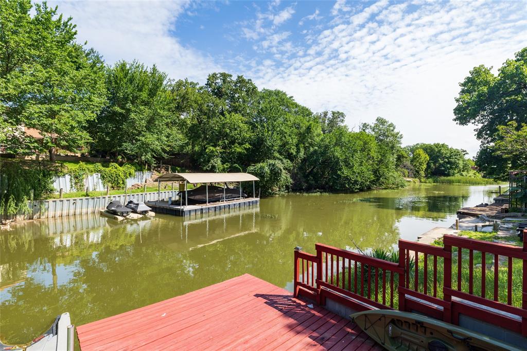 205 Timberlake Drive Azle, TX 76020 - Photo 33 of 40 a view of a lake with couches chairs