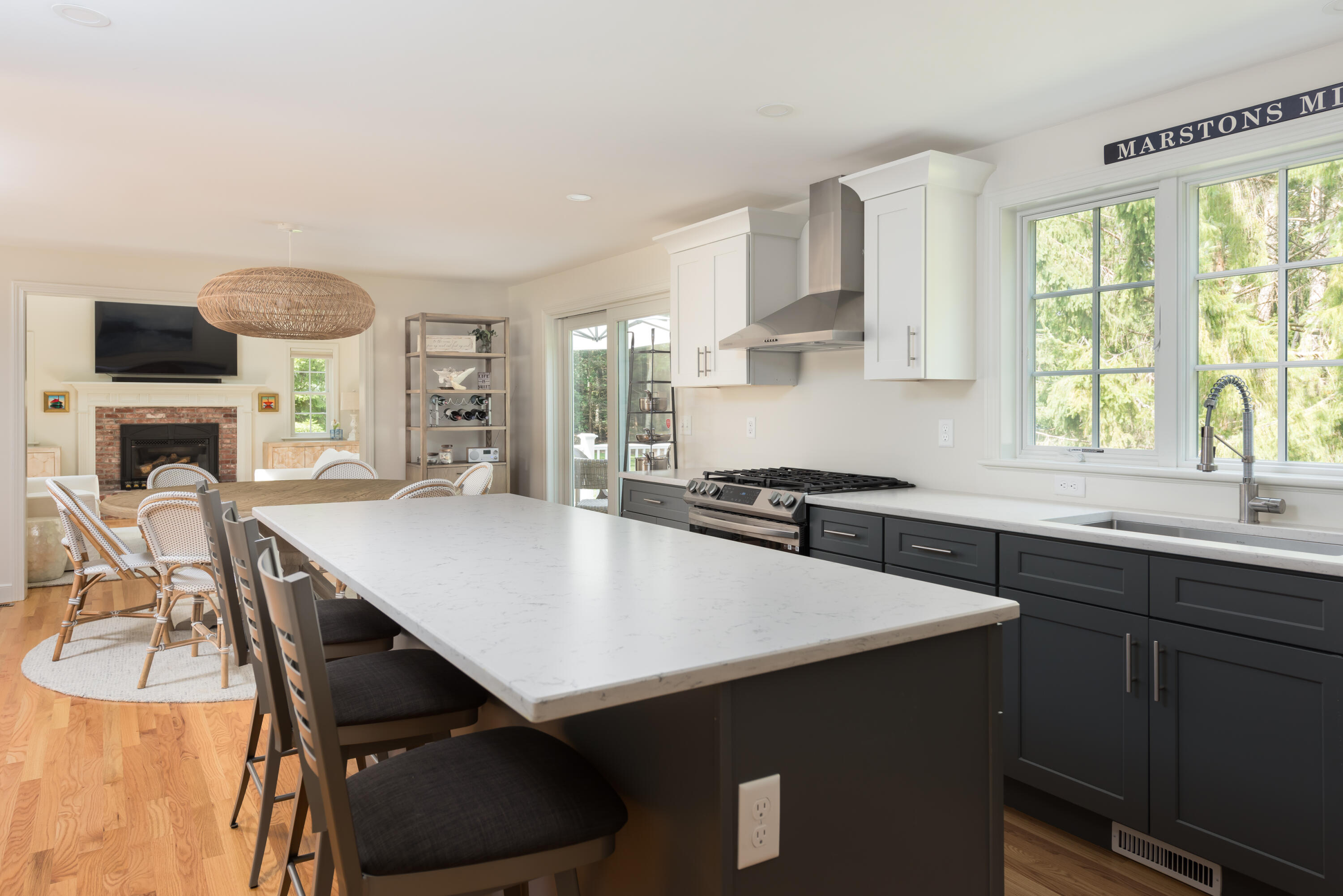 68 Tupelo Road Marstons Mills, MA 02648 - Photo 15 of 29 a kitchen with a table chairs sink and cabinets