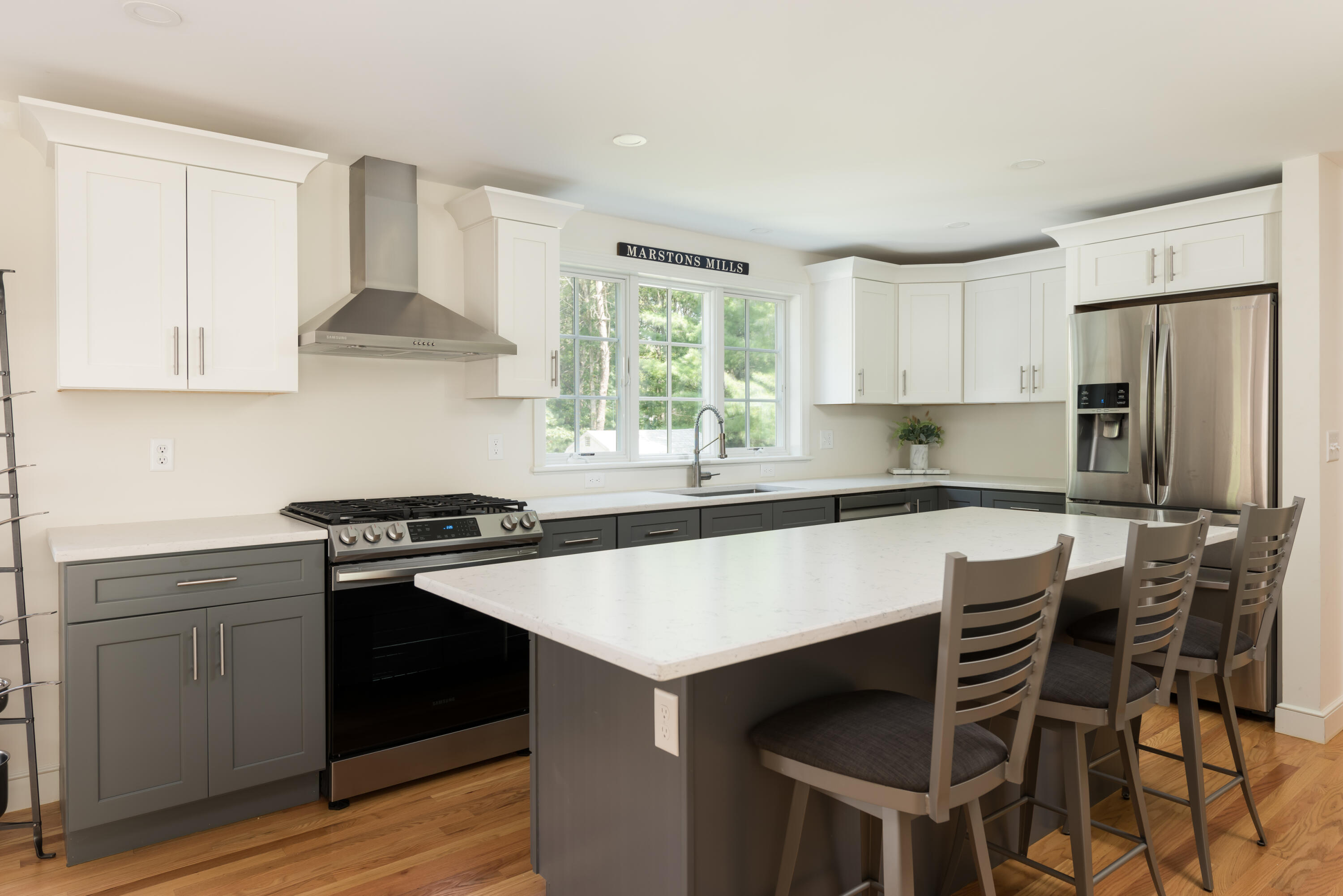 68 Tupelo Road Marstons Mills, MA 02648 - Photo 16 of 29 a kitchen with a stove a sink and a refrigerator