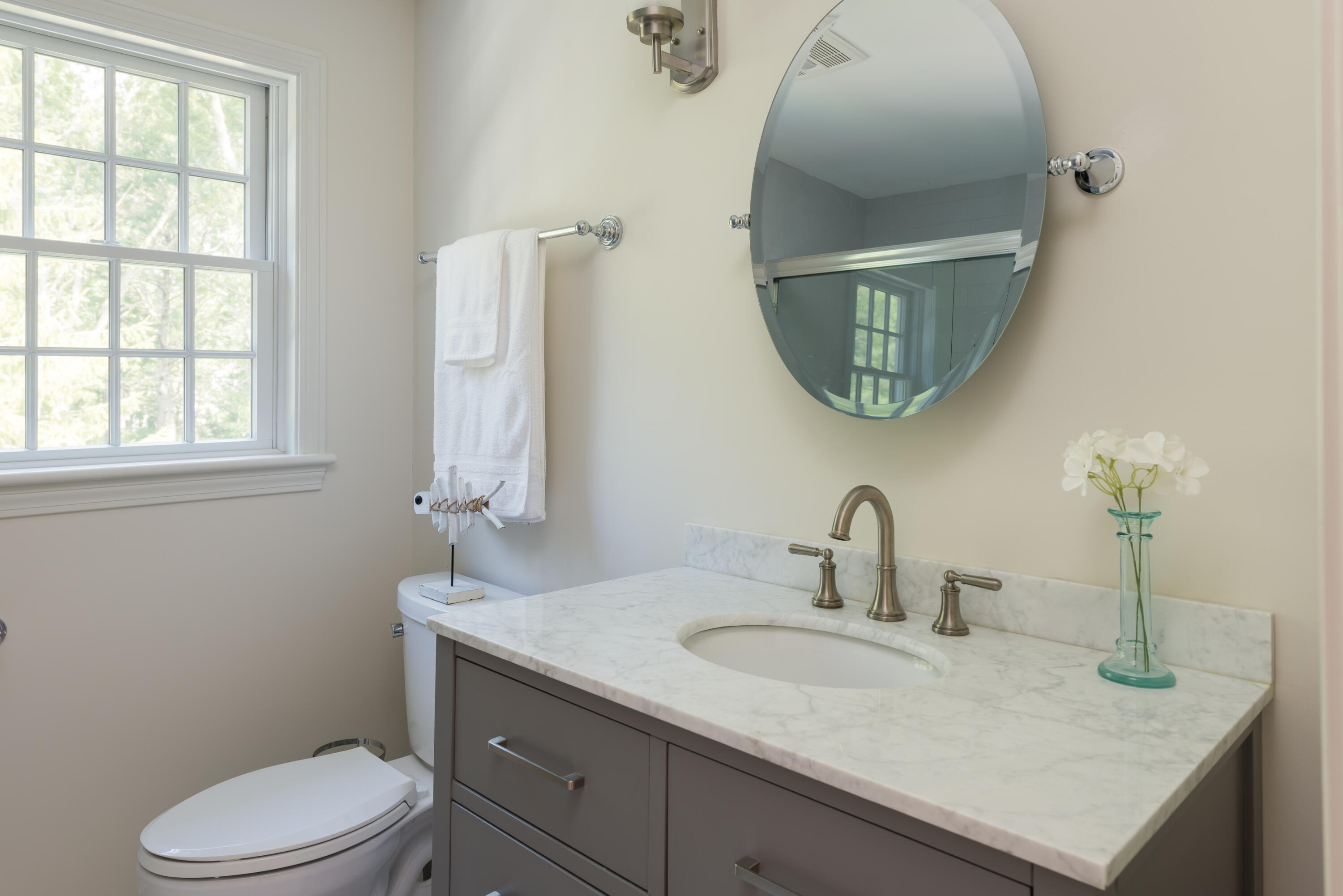 68 Tupelo Road Marstons Mills, MA 02648 - Photo 25 of 29 a bathroom with a toilet sink and mirror